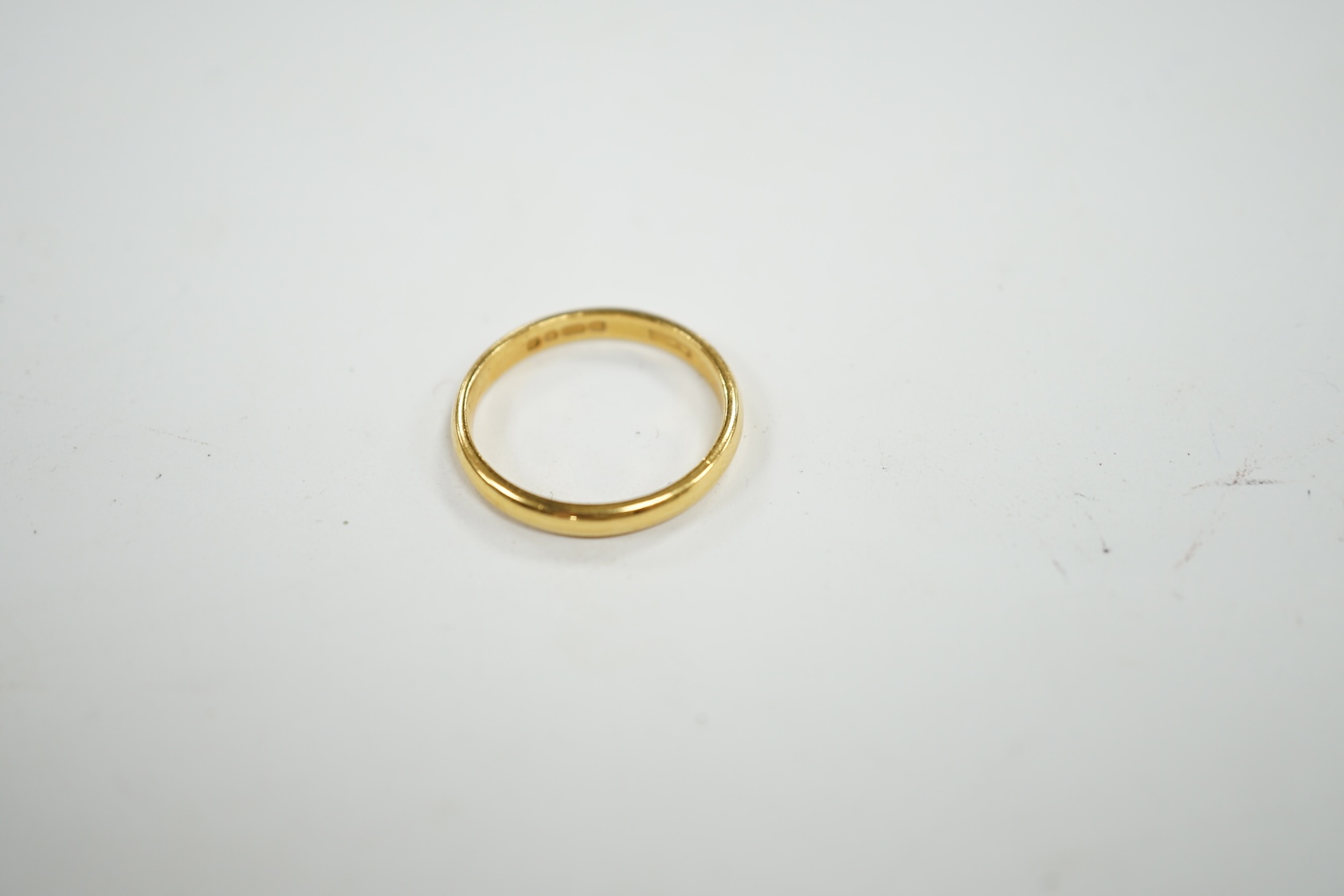 A 22ct gold wedding band, size N, 3.3 grams. Condition - fair to good